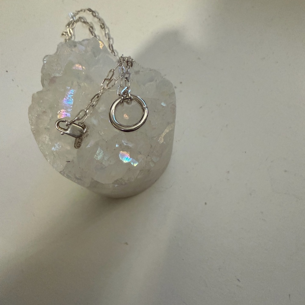 Silver mini paperclip necklace with a ring charm holder